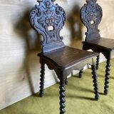 Duo of carved wooden chairs