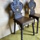 Duo of carved wooden chairs