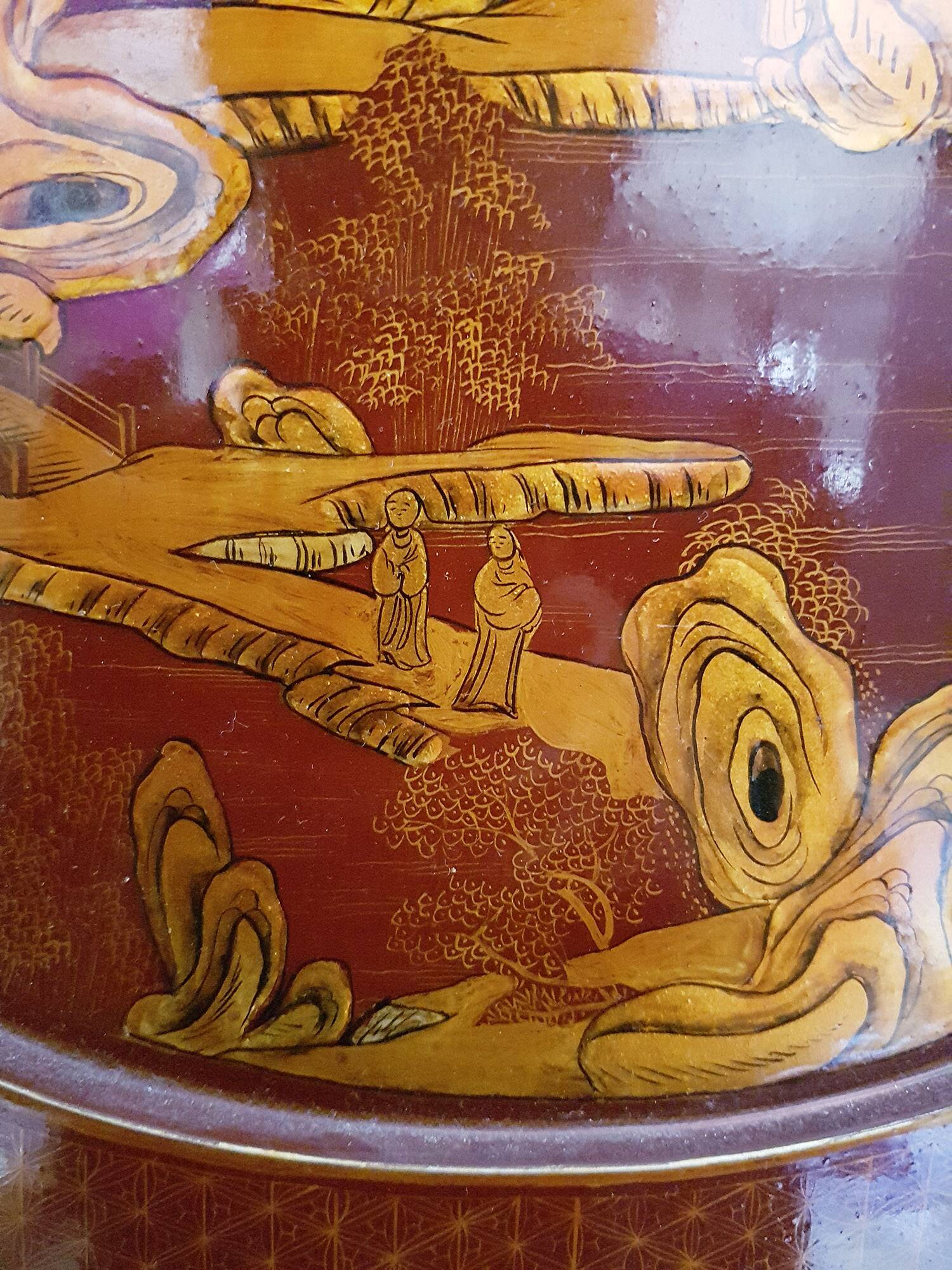 Four-panel Japanese-style screen in red and gold lacquer.