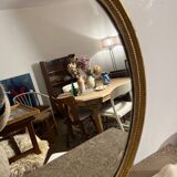 Old golden oval mirror