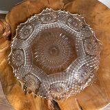 Vintage pressed glass plate with rosette design, octagonal rim, star pattern reminiscent of mandala