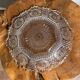 Vintage pressed glass plate with rosette design, octagonal rim, star pattern reminiscent of mandala