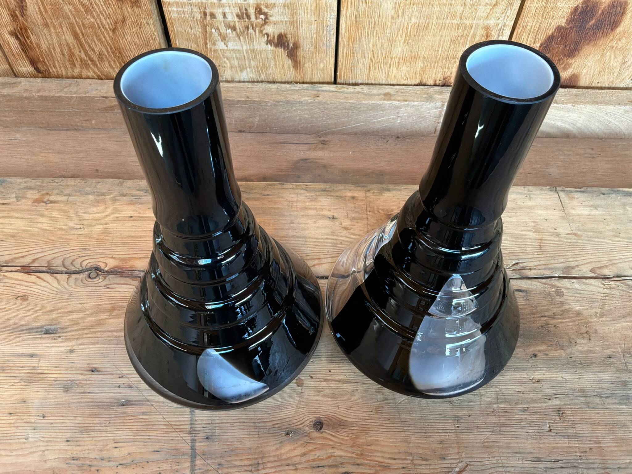 Pair of black and opaline multilayer glass vases. 1970s.