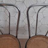 Pair of chrome and cane bistro chairs from the 70s.