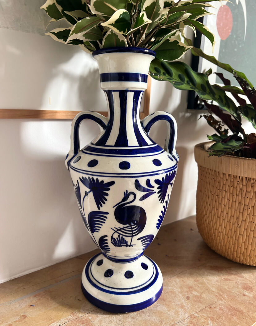 white amphora-style vase with hand-painted blue patterns