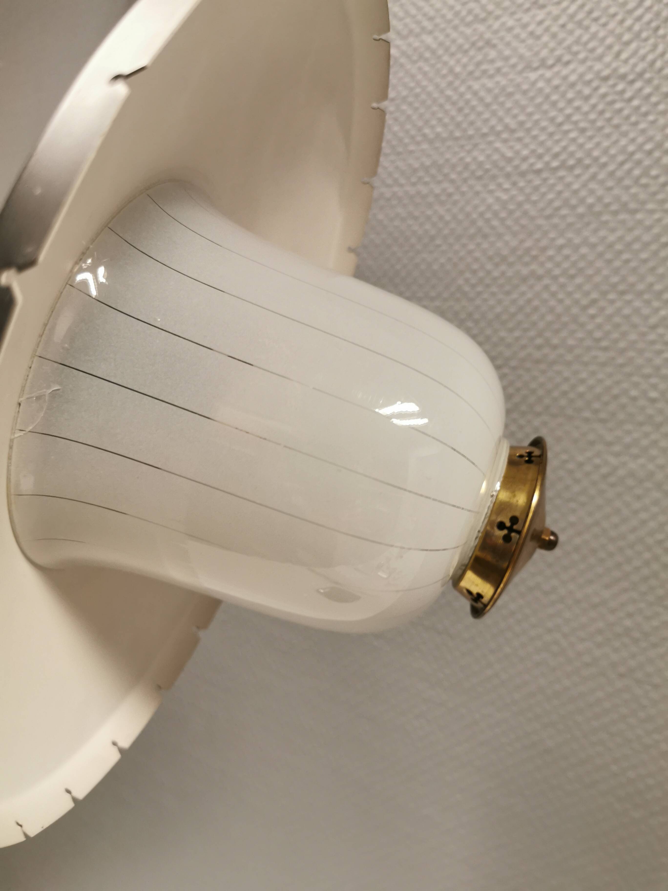 Hanging lamp in glass with black lacquered metal shade and brass base.