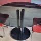 Round black smoked glass dining table + 2 terracotta chairs