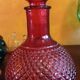 Red glass vitae bottle