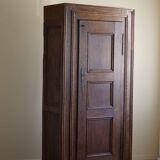 Tall antique oak wardrobe, made by a French cabinetmaker, late 19th century.