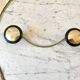 silver and black metal coat hook from the 70s