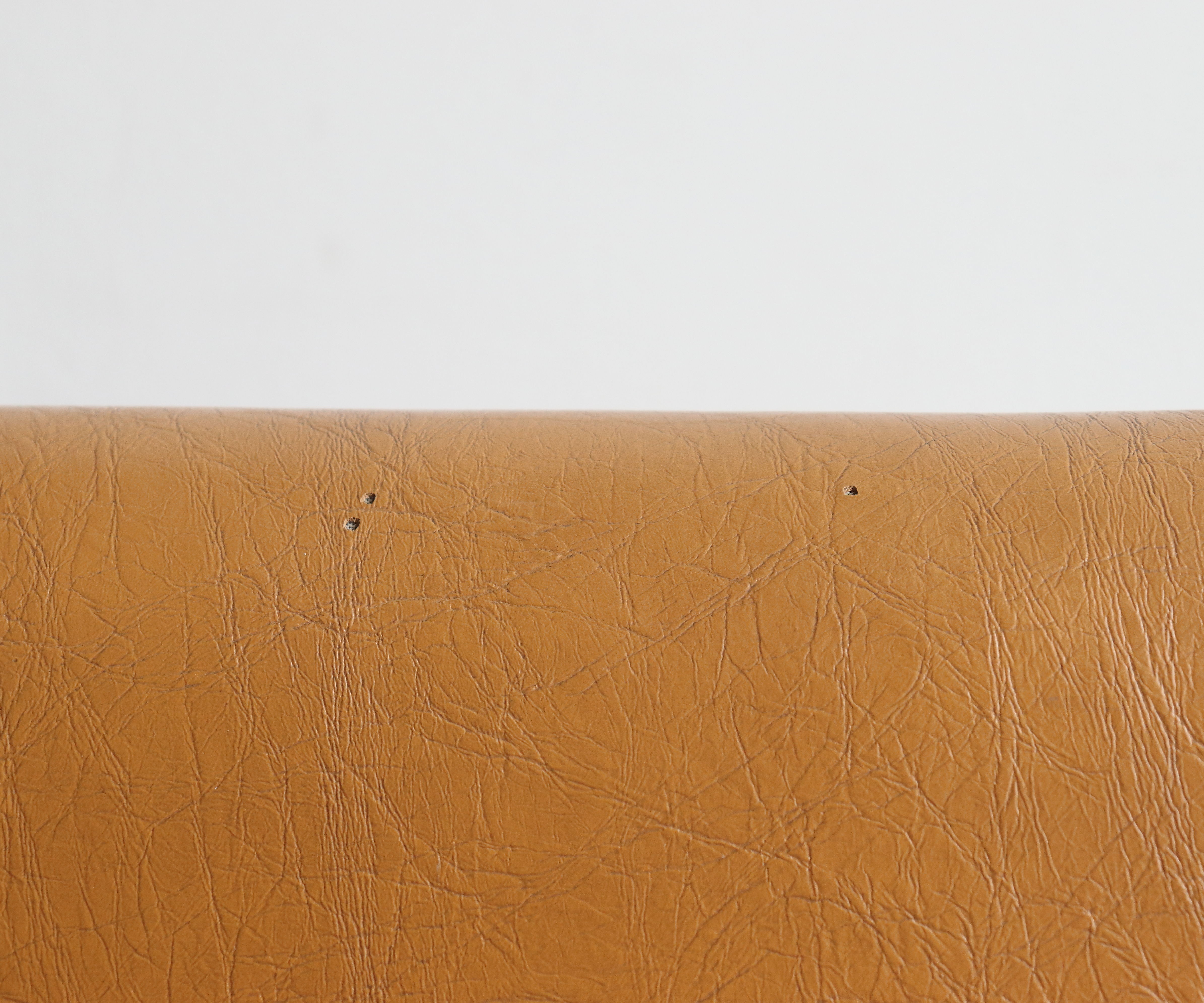 Modernist armchair in chromed metal and imitation leather, 50s/60s