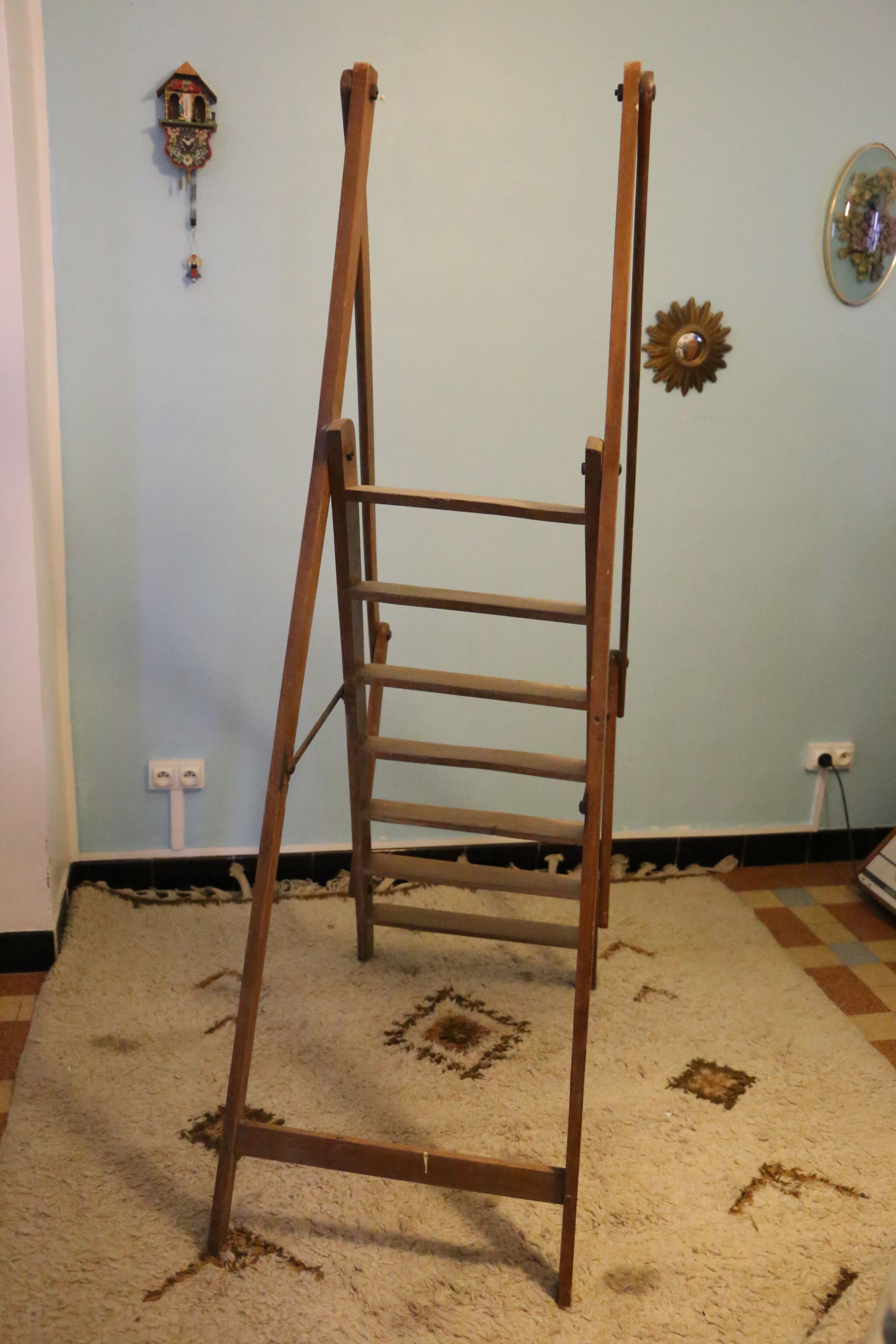 Old wooden stepladder with bodyguards