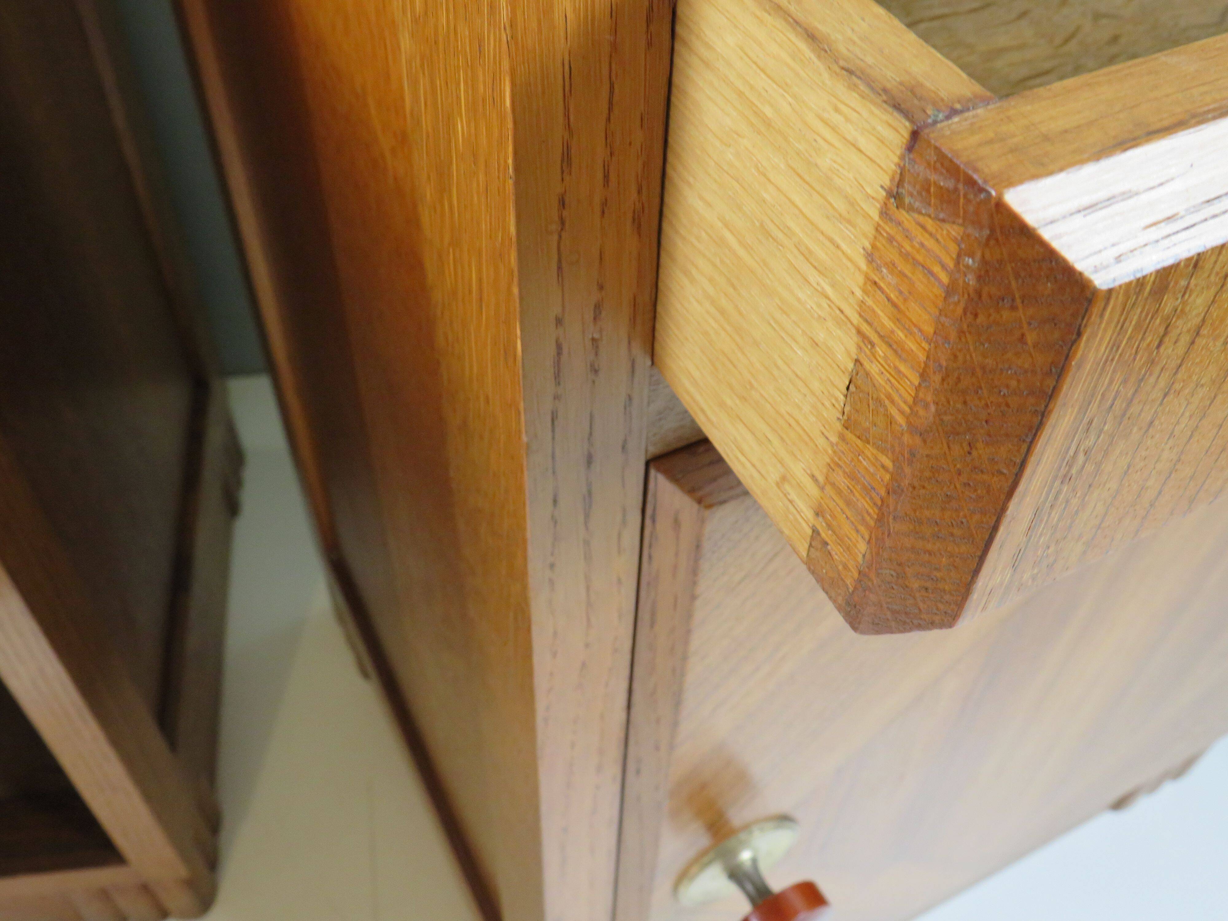 Art Deco bedside tables in oak with an inlaid marble top.