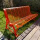 Orange pierced sheet metal bench