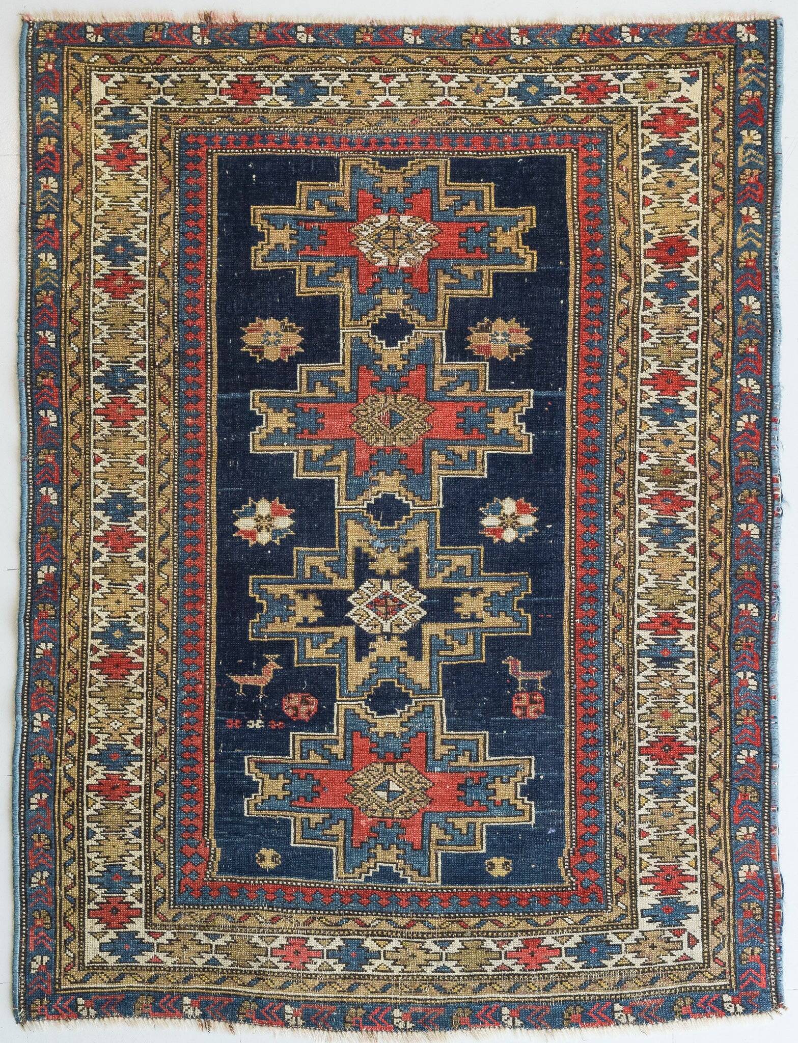 Handwoven Antique - Blue Ground Persian Rug with Bird-like Figures