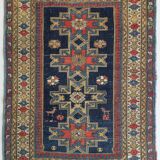 Antique tissé à la main - Tapis persan à fond bleu avec des figures ressemblant à des oiseaux