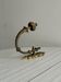antique wall hook, gilded sculpted metal