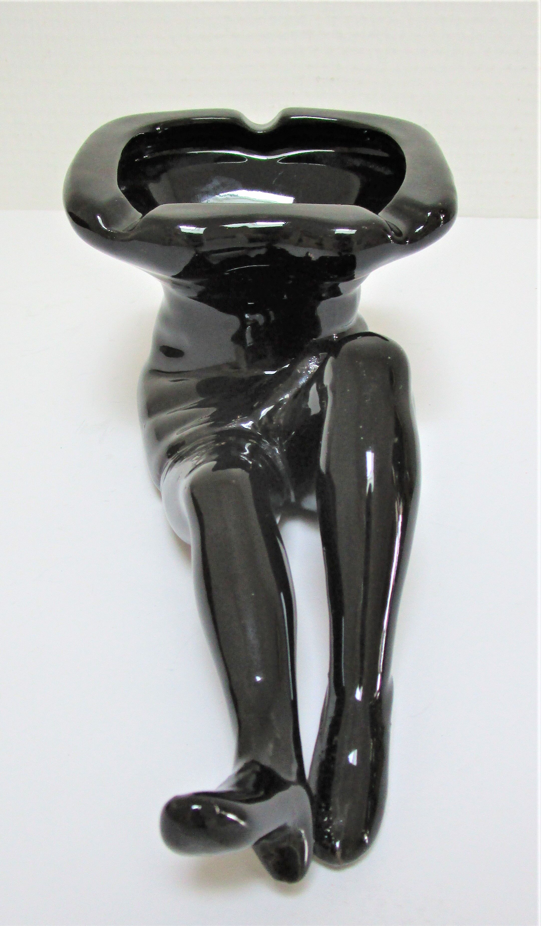 Anthropomorphic ashtray legs ceramic black design 80s