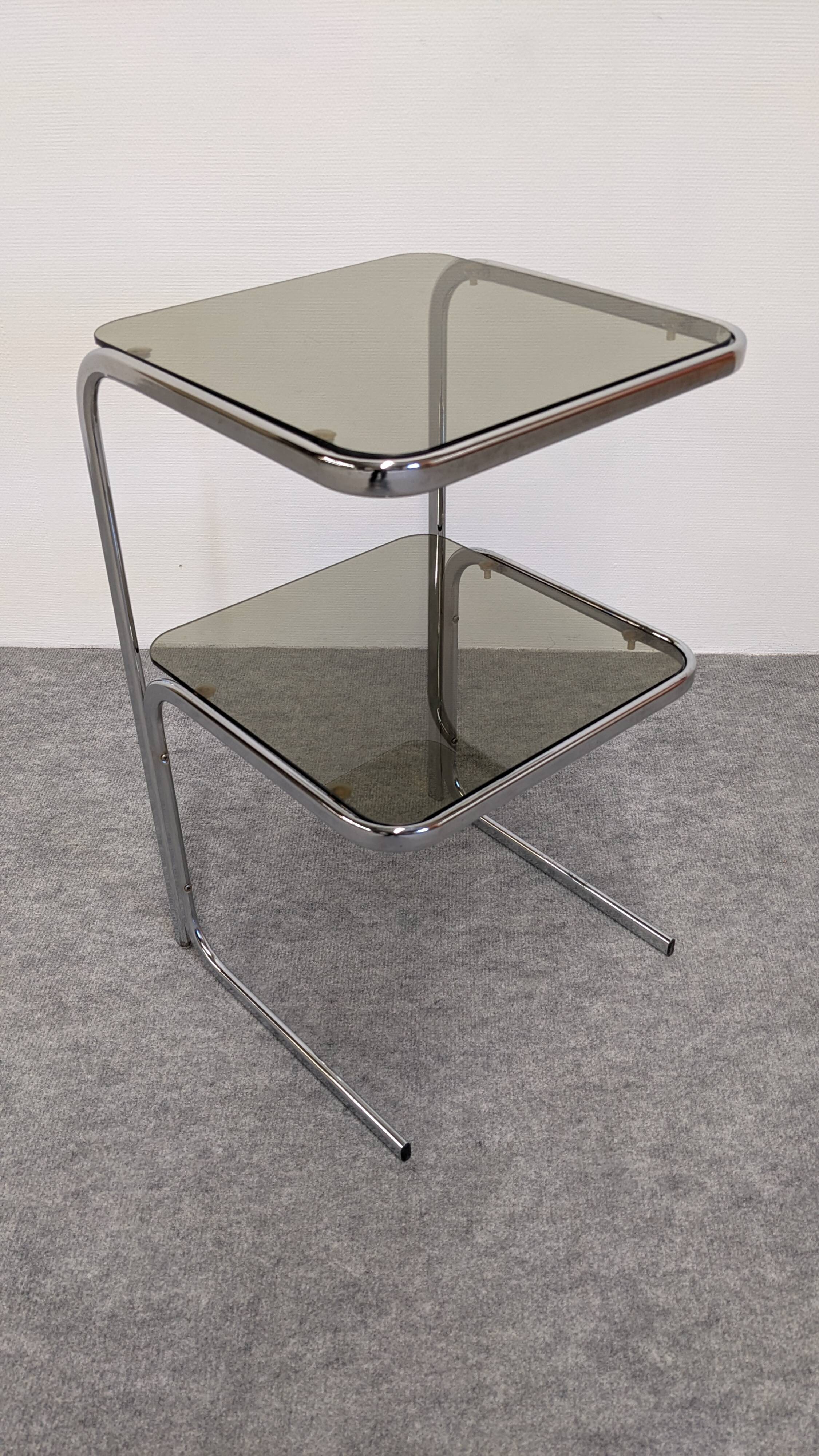 Chrome and smoked glass side table or end table, France circa 1970.