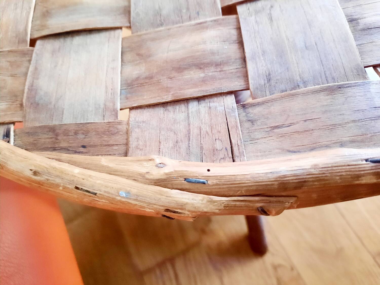 Old bamboo/rattan table with woven palm leaves.