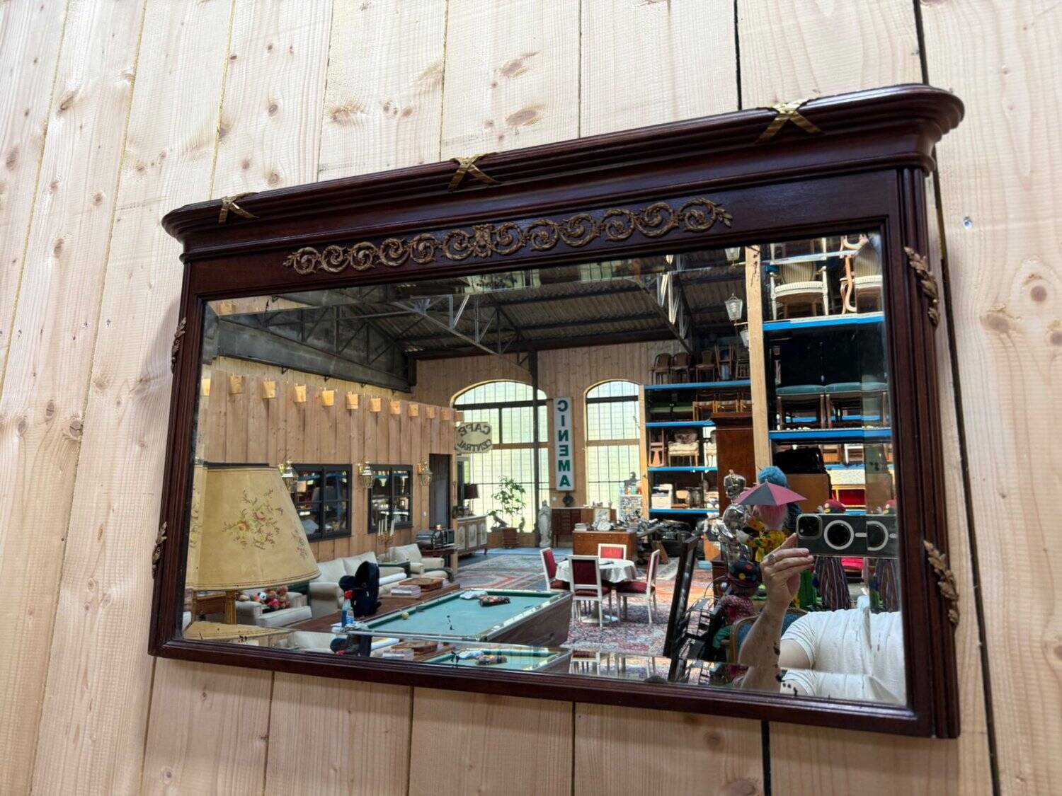 Louis XVI style mirror in mahogany and gold.