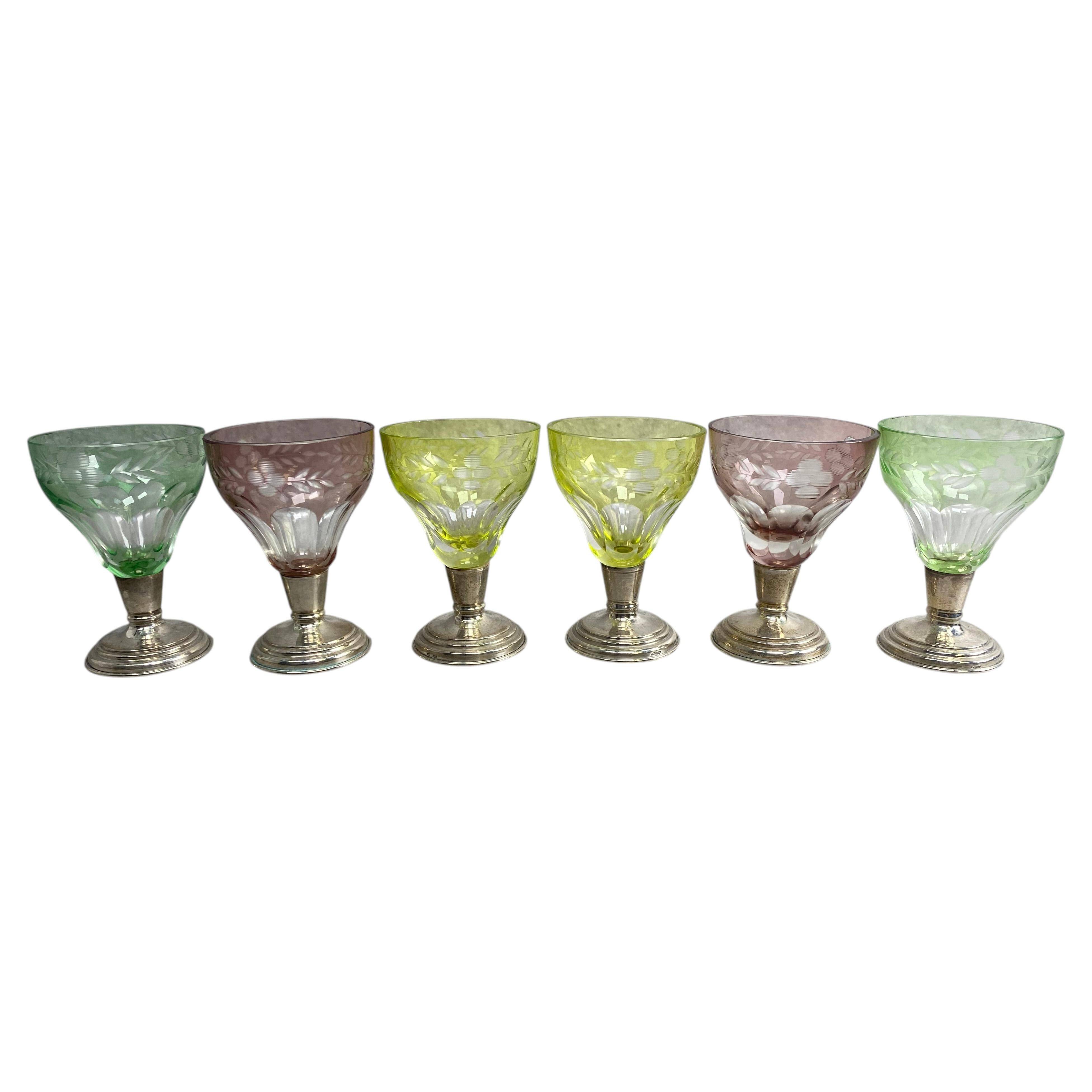 Set of 6 coloured stemmed glasses on silver stems.