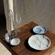 Vintage silver-plated shell butter dish with transparent bowl.