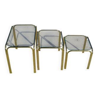 Nesting tables in gold-tone metal and glass
