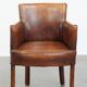 Amazing cognac-coloured sheepskin dining/side chair with armrests