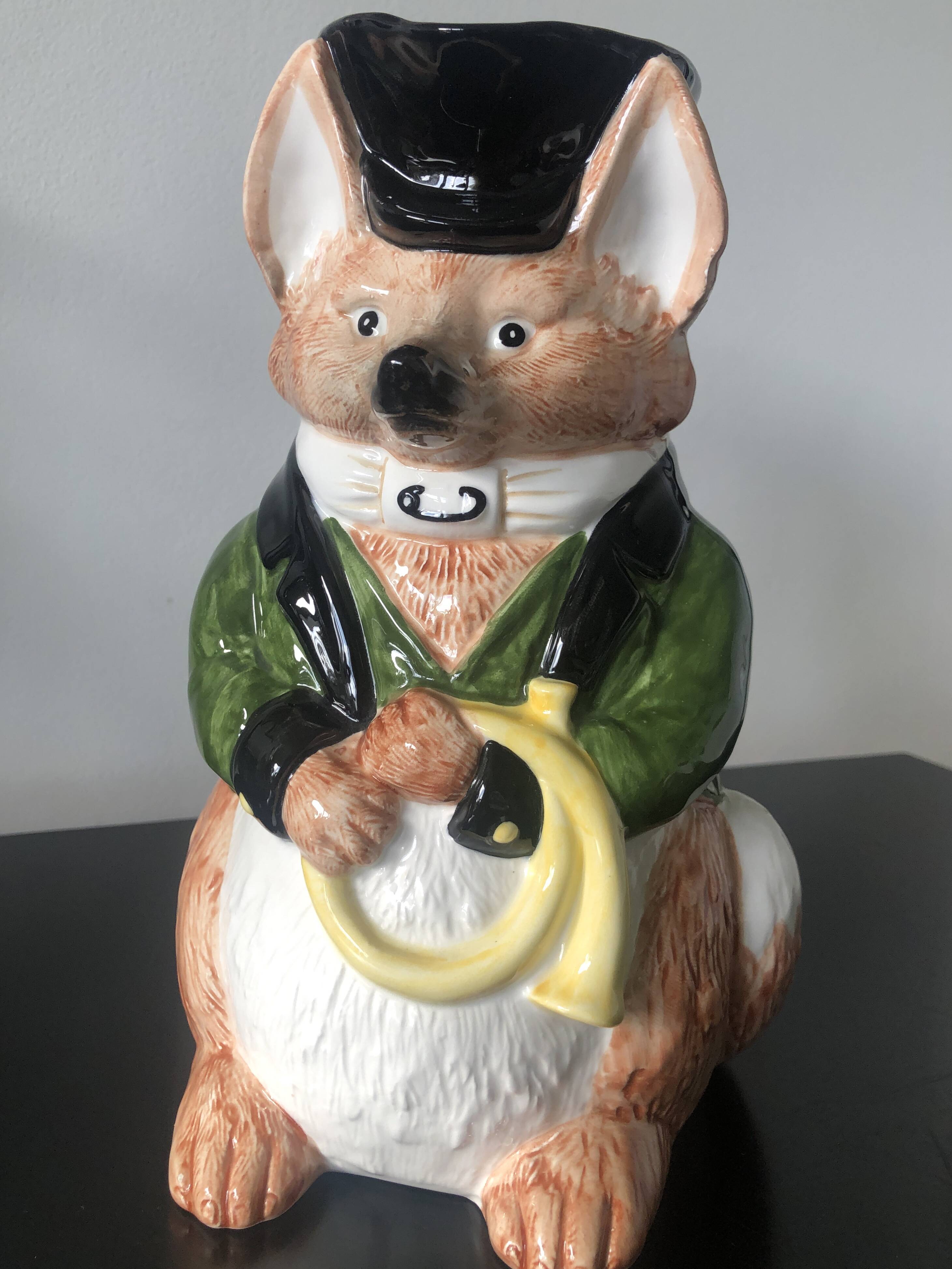 Ceramic jug representing a fox in hunting attire date 1986