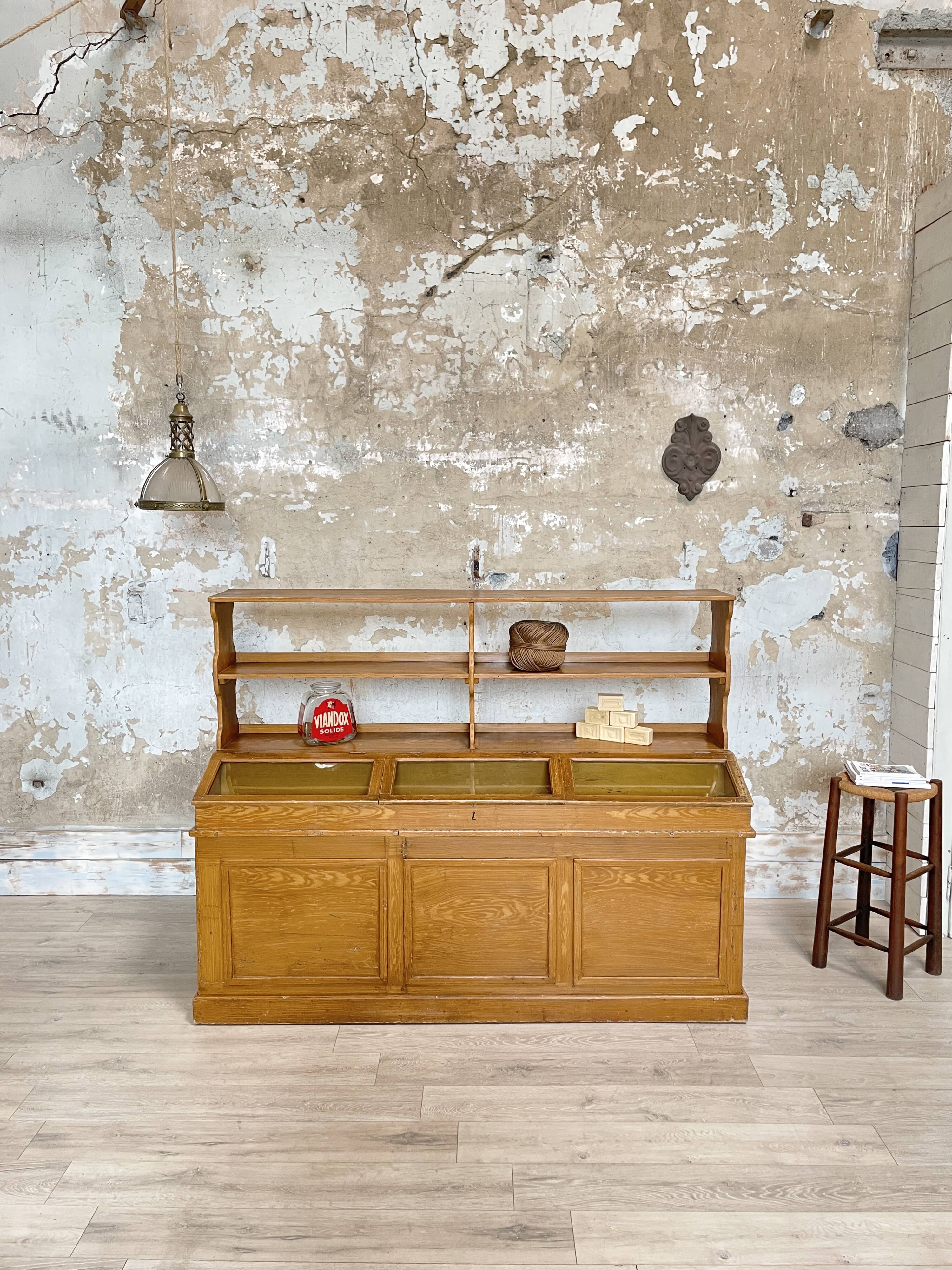 Wooden hardware cabinet painted with wood effect, circa 1940.