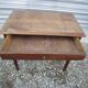 Wooden side table with drawer