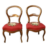Pair of Louis Philippe walnut chairs, petit point tapestry