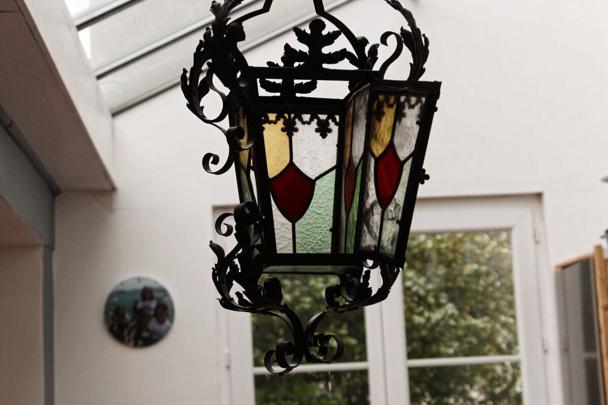 Wrought iron lantern and stained glass windows