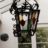 Wrought iron lantern and stained glass windows