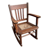 Children's rocking chair in dark wood and cane