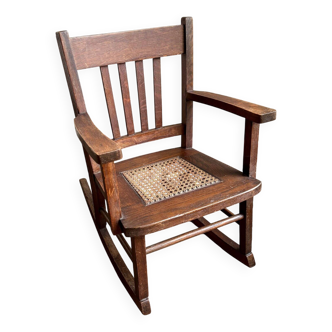 Children's rocking chair in dark wood and cane