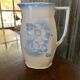 Vintage ceramic pitcher in white and blue from Gránitgyár Budapest, 1960s — floral halo pattern, square handle.