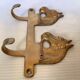 Wall-mounted coat rack with horses in brass