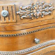 Pair of bow-fronted chests of drawers in walnut