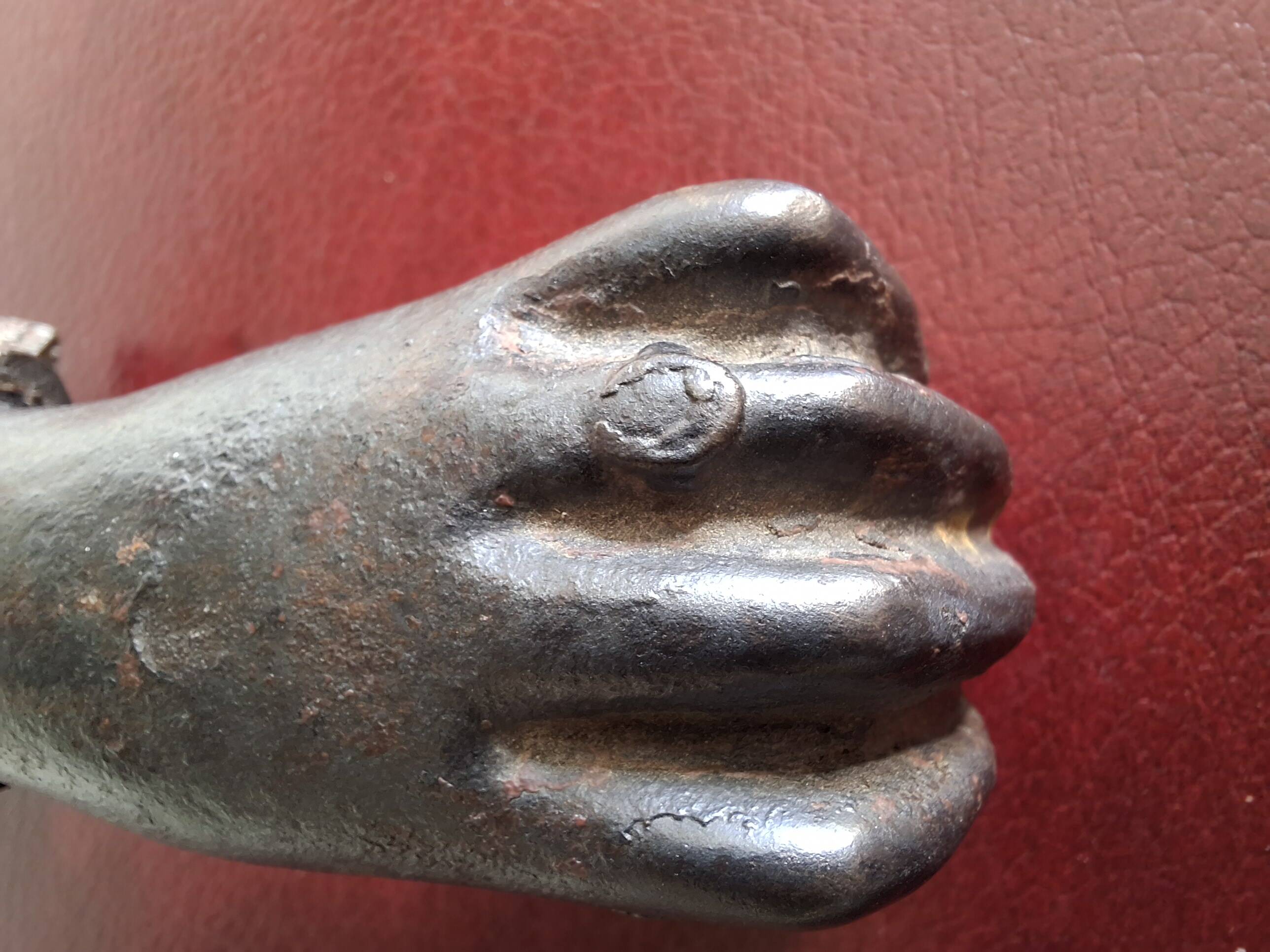 Cast iron door knocker from the 19th century or earlier.