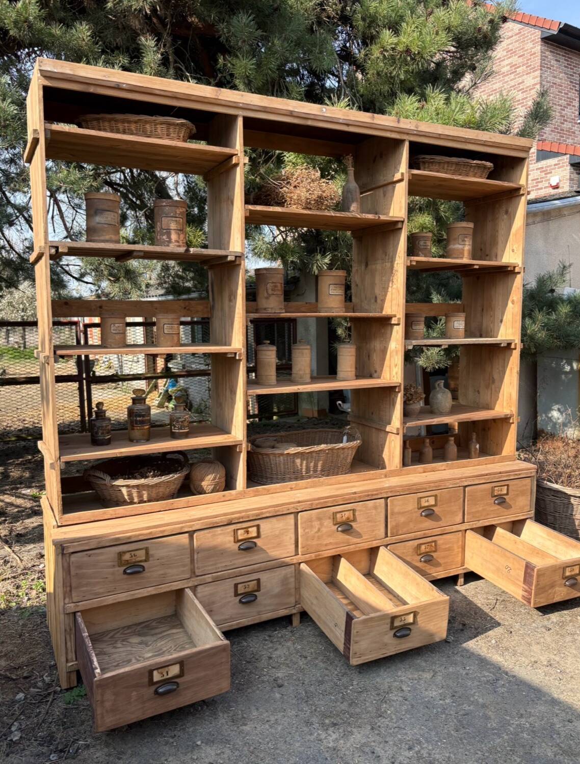 Large antique workshop furniture with drawers and shelves.