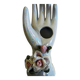 Hand holds jewelry or soliflore