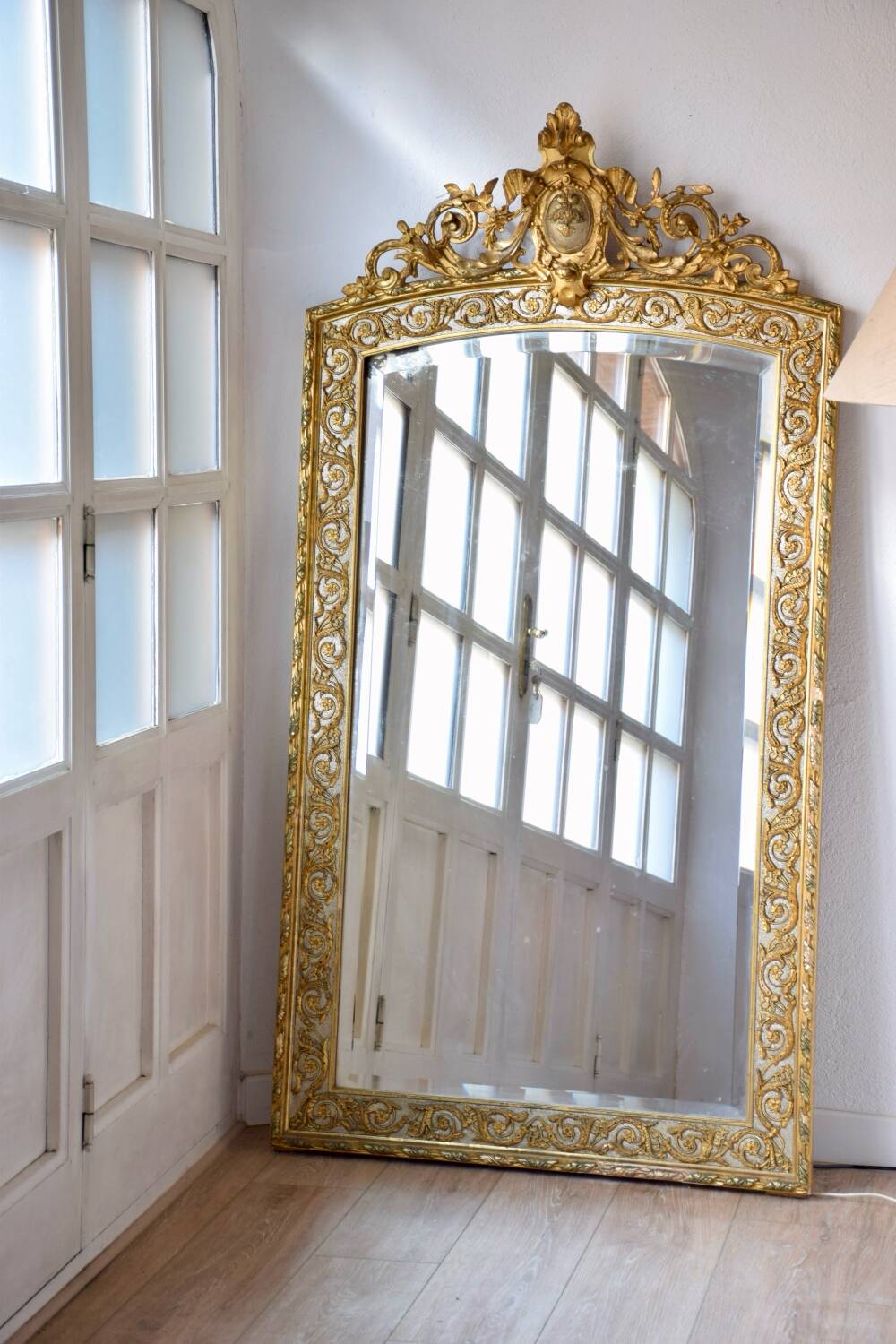 Large antique gilded mirror in the Baroque style