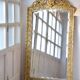 Large antique gilded mirror in the Baroque style