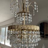 Cascade chandelier with crystal and brass tassels