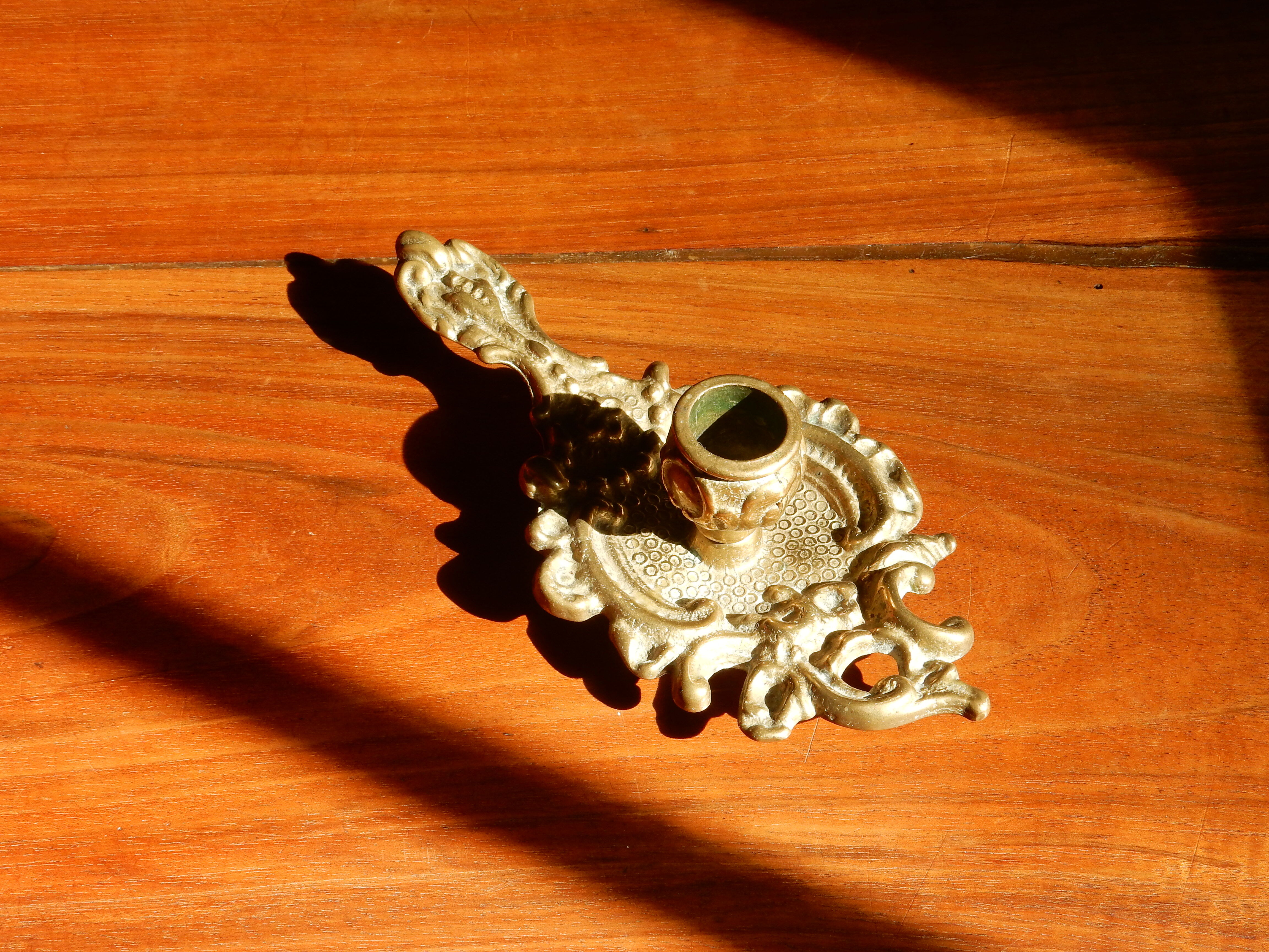 Bronze hand candle holder, cellar rat