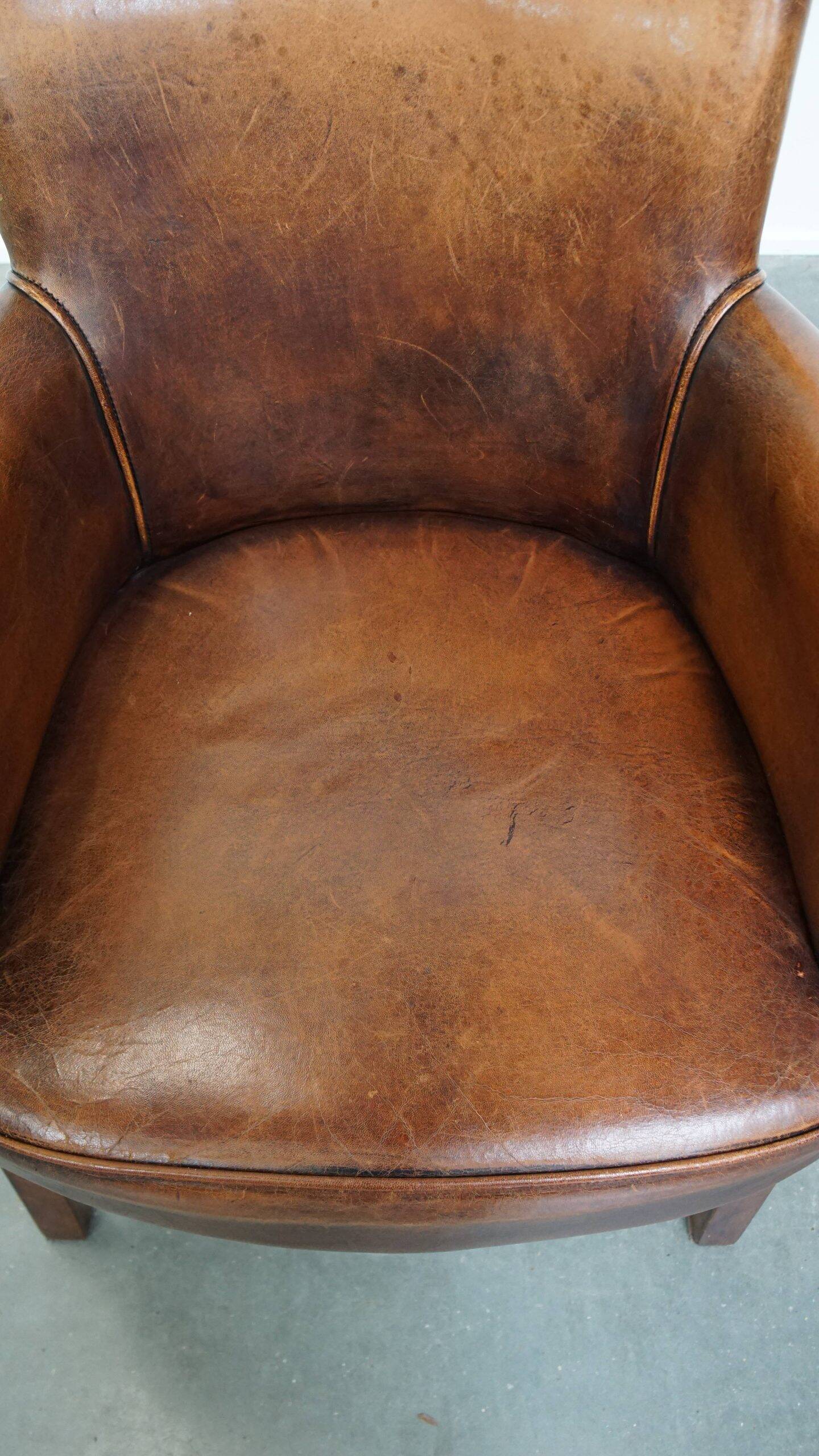 Amazing cognac-coloured sheepskin dining/side chair with armrests
