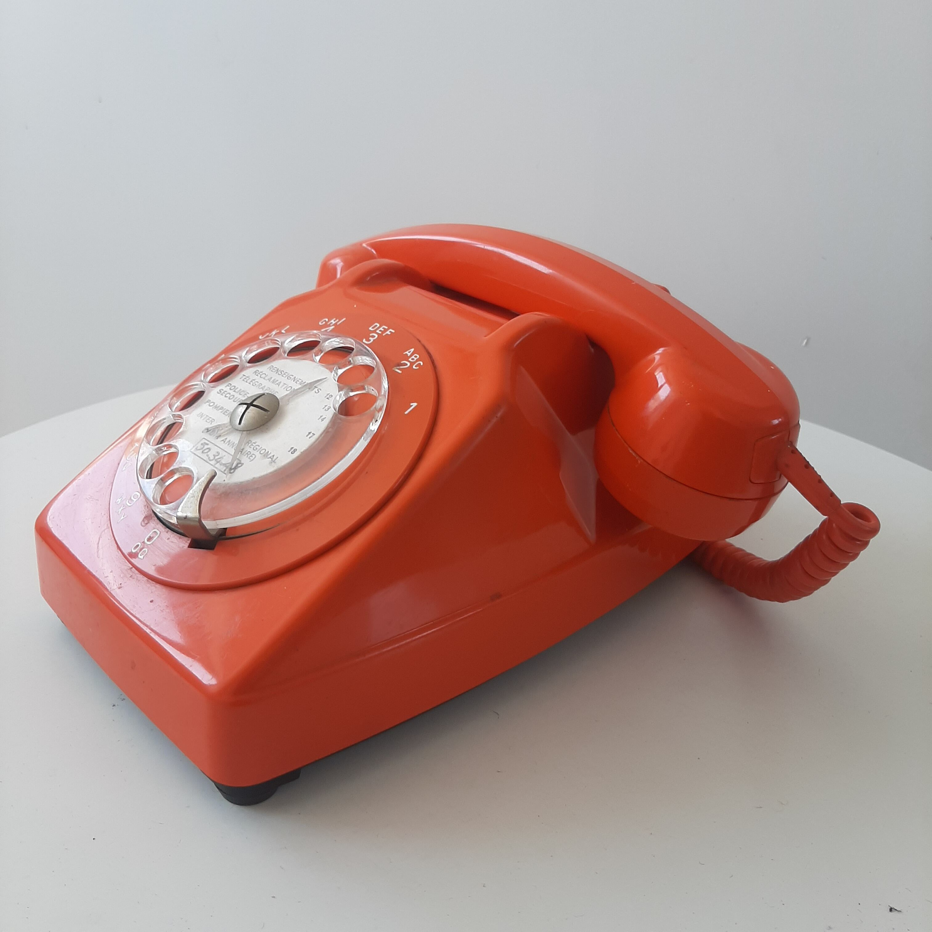 Vintage orange dial telephone