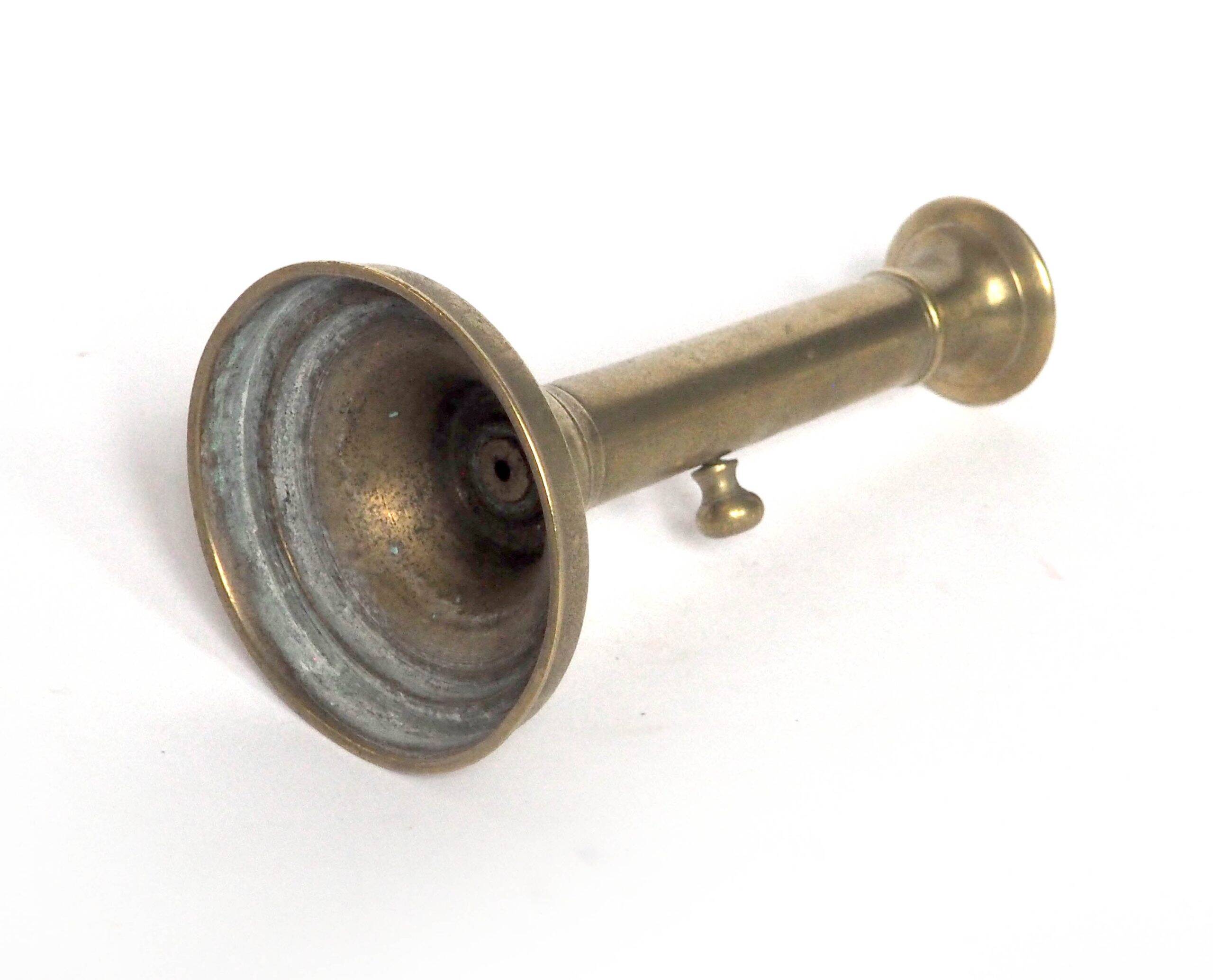 Brass candlestick with a column and bobeche.